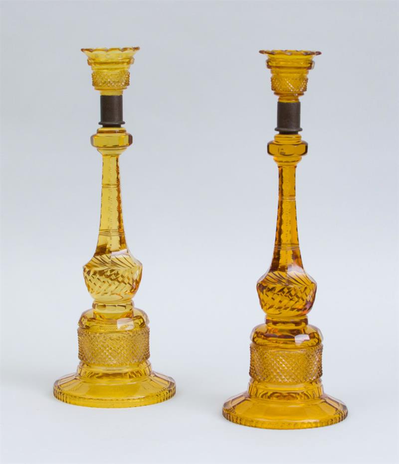 Appraisal: PAIR OF CUT AMBER GLASS TALL CANDLESTICKS With metal liners