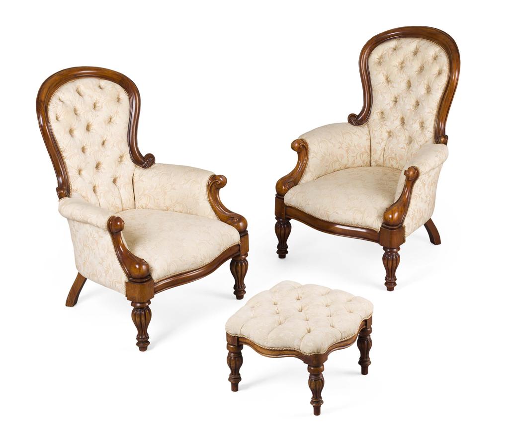 Appraisal: PAIR OF BUTTON UPHOLSTERED WALNUT ARMCHAIRS AND FOOTSTOOL TH CENTURY