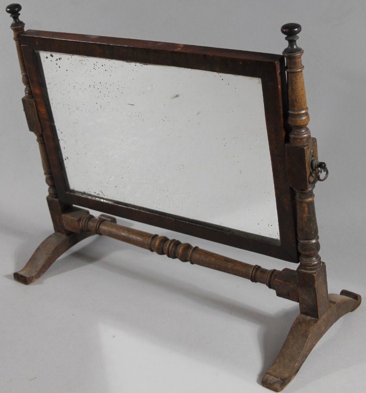 Appraisal: An early thC mahogany framed table mirror with rectangular plate