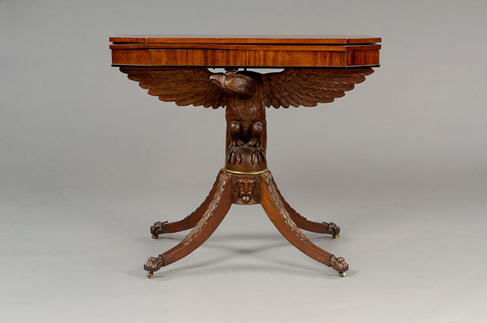 Appraisal: SHERATON-STYLE AMERICAN EAGLE CARVED MAHOGANY CARD TABLE The rectangular hinged