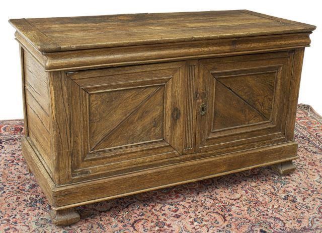 Appraisal: French Provincial oak chest th c having a flat-hinge top