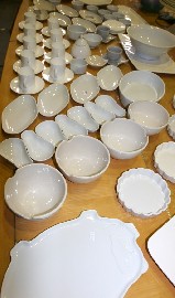 Appraisal: A collection of white ceramics including coffee cups and saucers