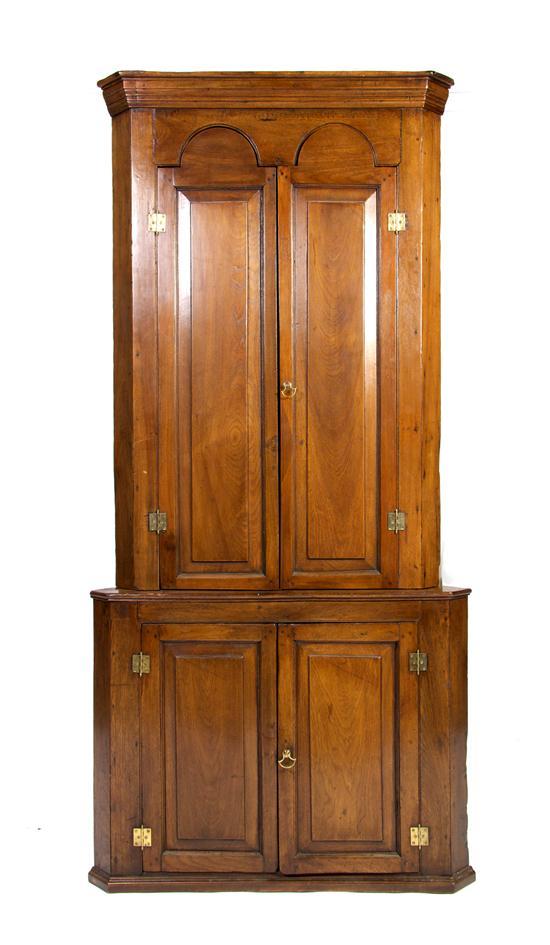 Appraisal: A Queen Anne Style Walnut Corner Cupboard in two parts