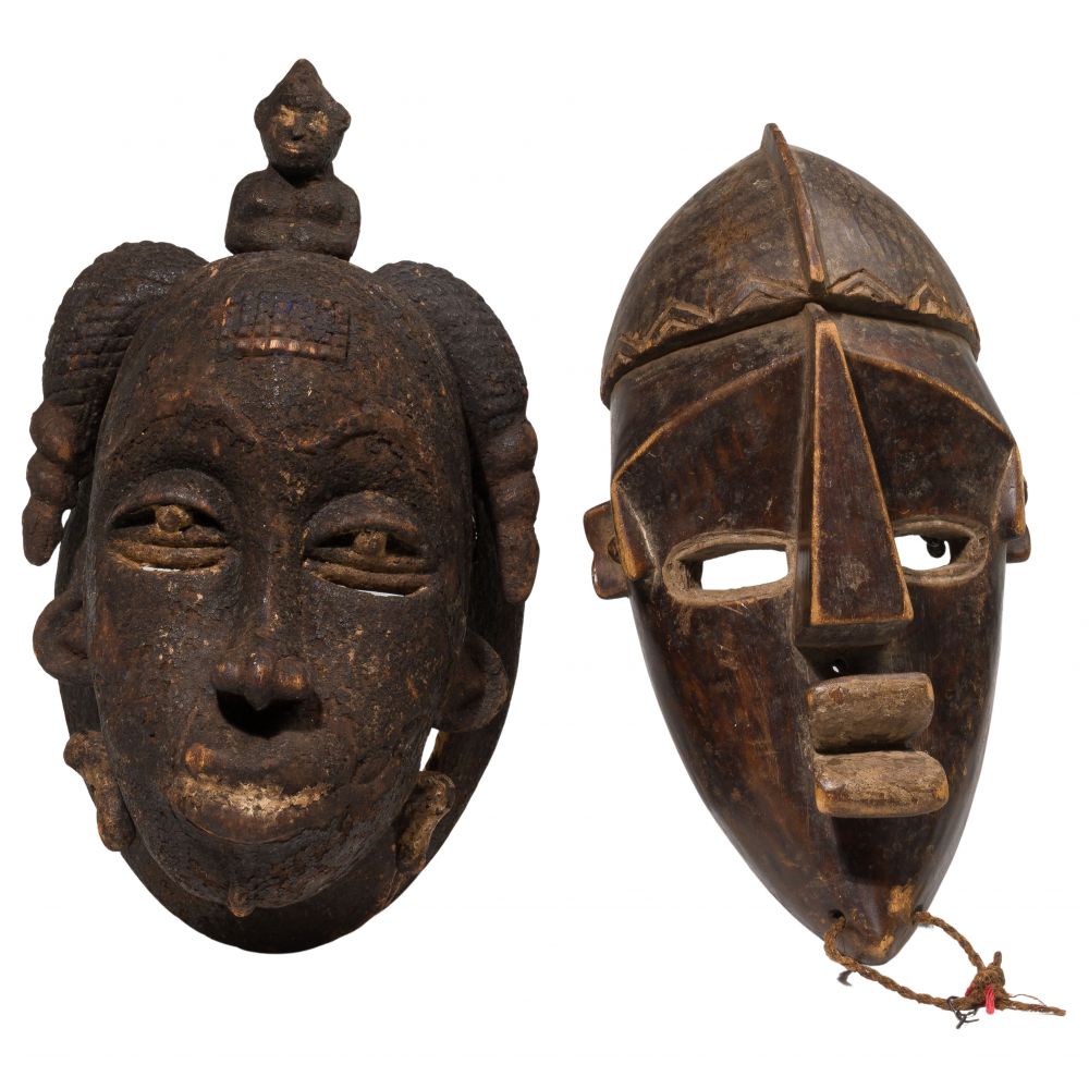 Appraisal: AFRICAN CARVED WOOD TRIBAL MASKS items including a female mask