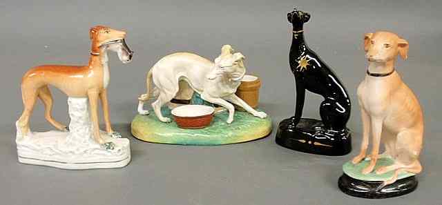 Appraisal: Staffordshire standing whippet with game h and three other dogs