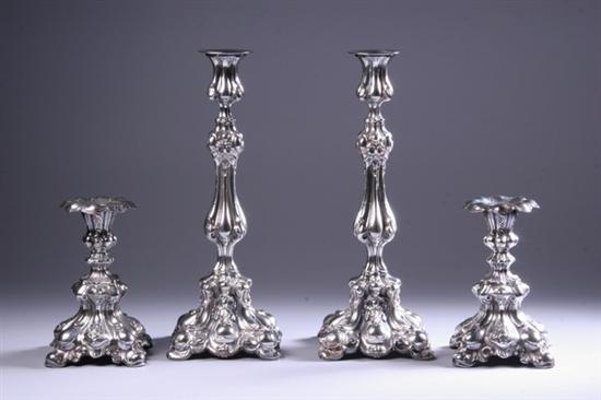 Appraisal: TWO PAIR CONTINENTAL SILVER BAROQUE-STYLE CANDLESTICKS Each of hollow form