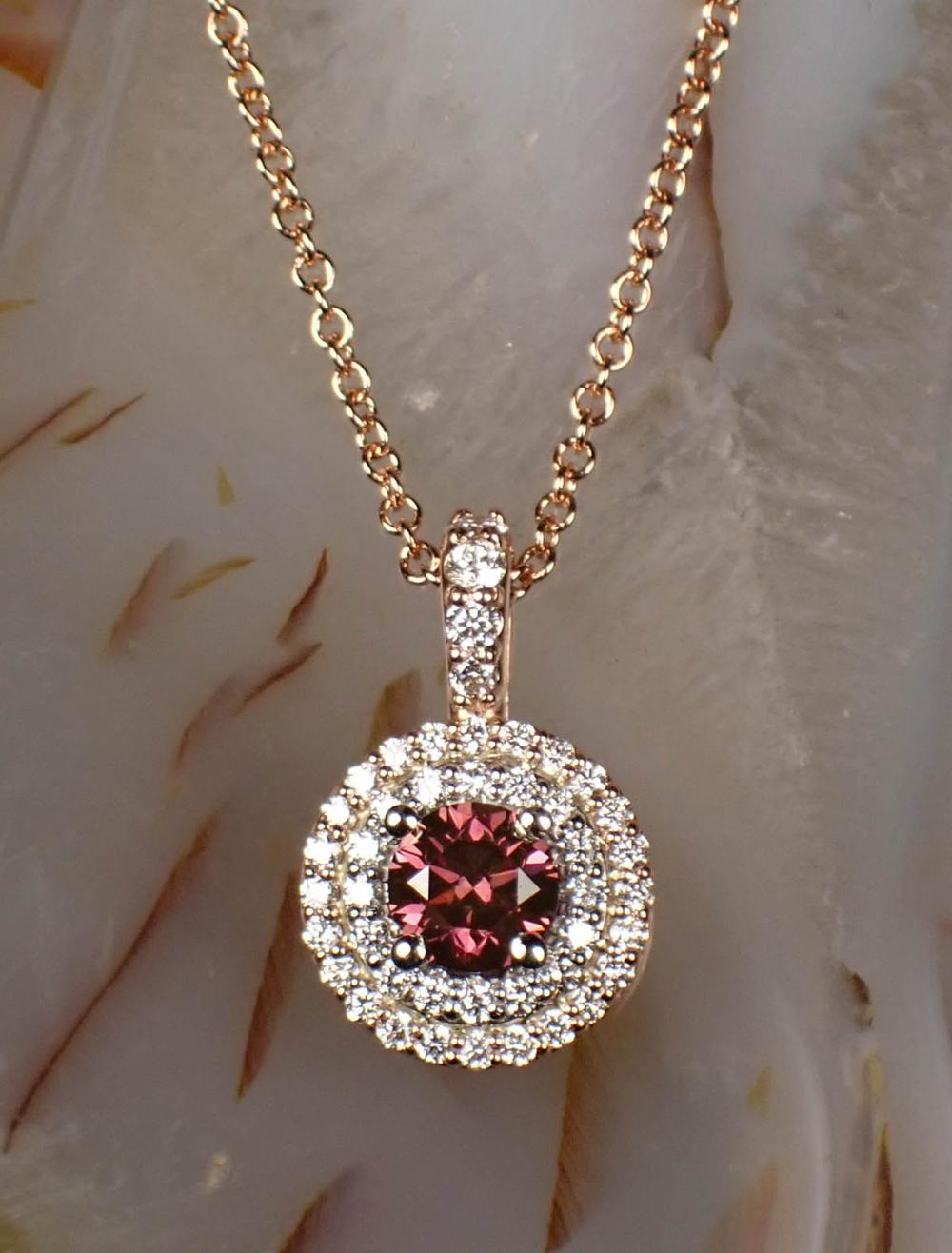 Appraisal: FANCY PINK DIAMOND AND FOURTEEN KARAT GOLD PENDANT NECKLACE with