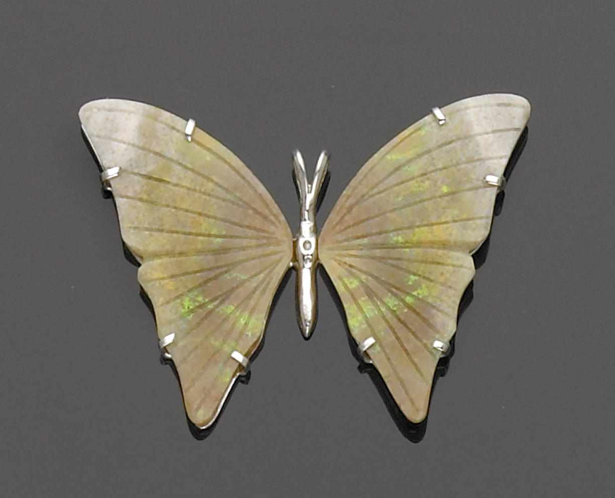 Appraisal: Carved Opal Butterfly Pendant Andamooka Australia While most Andamooka matrix