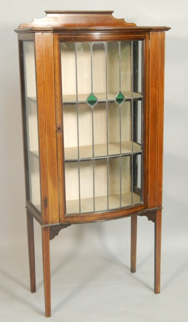 Appraisal: An Edwardian mahogany and boxwood strung display cabinet with a