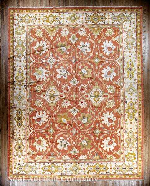 Appraisal: An Oushak Rug Turkish crimson and cream ground allover floral