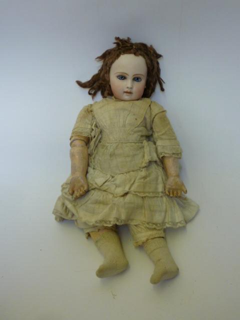 Appraisal: An early Parisian bisque head doll with closed mouth fixed