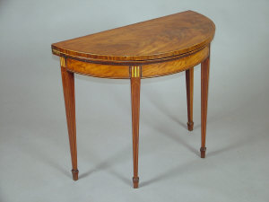 Appraisal: A late George III mahogany and inlaid demi-lune foldover tea