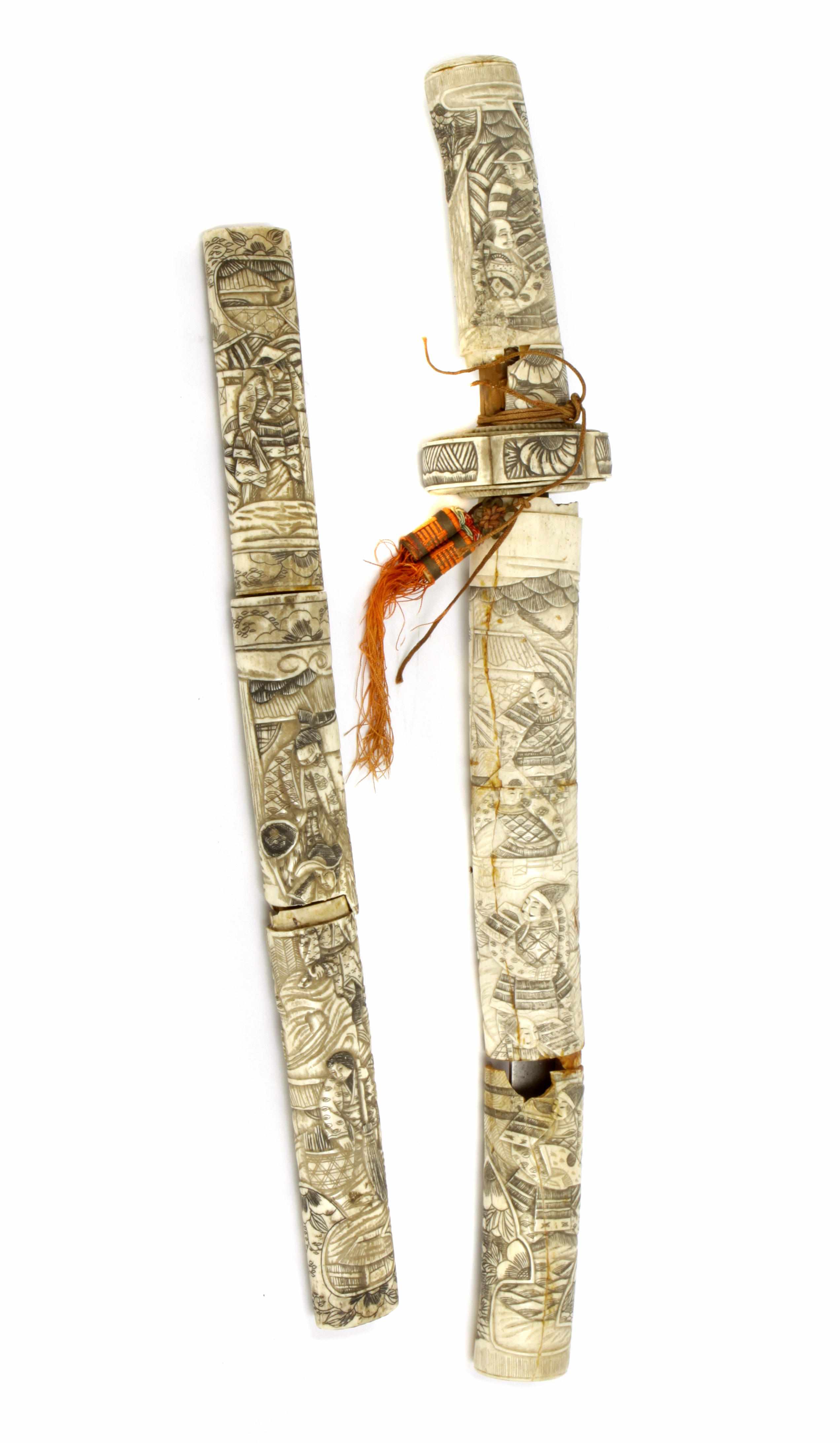 Appraisal: A pair of Japanese bone daggers with incised decoration circa