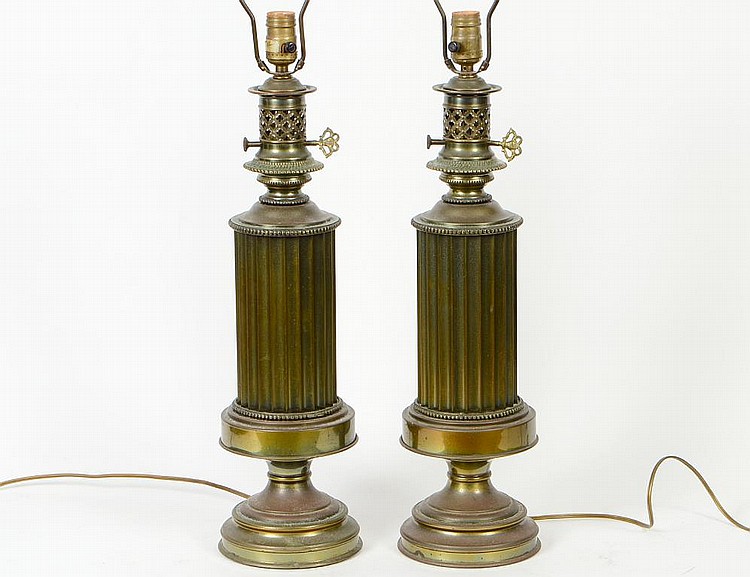 Appraisal: PAIR OF REEDED BRASS COLUMNAR LAMPSModern Resembling oil lamps with