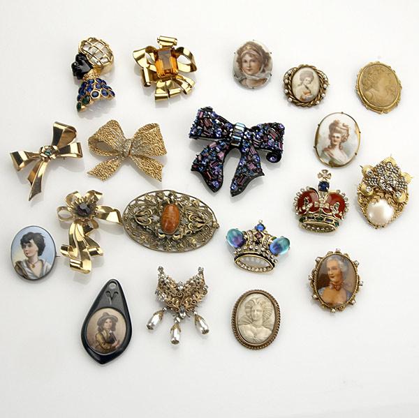 Appraisal: COSTUME BROOCHES Nineteen pieces - Portraits bow-knots crowns Coro lucite