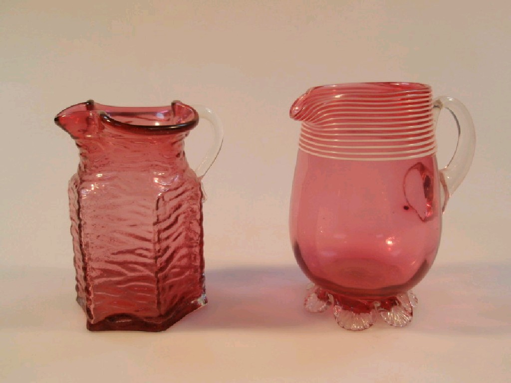 Appraisal: A thC cranberry glass cream jug with white trailed border