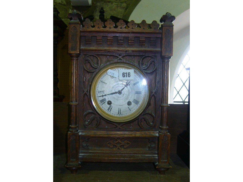 Appraisal: A Victorian oak mantle clock with carved geometric detail column