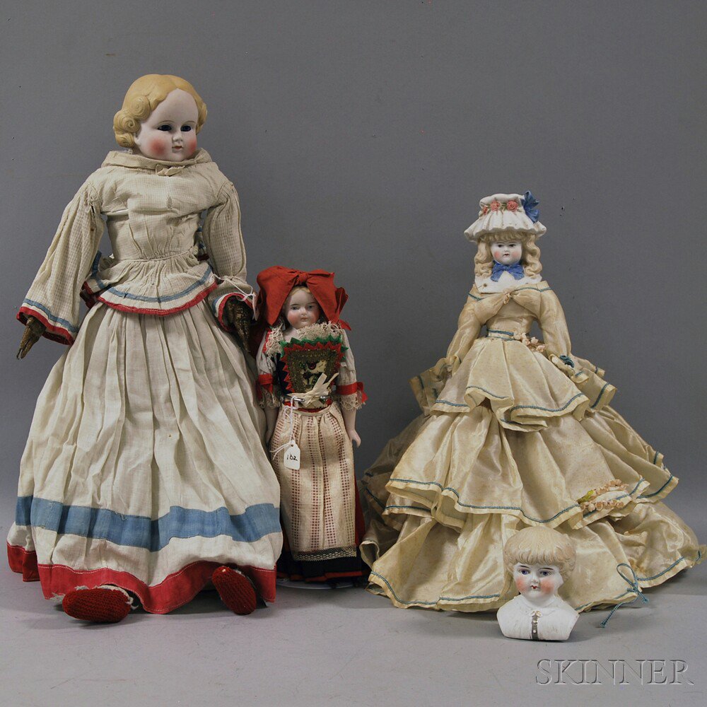 Appraisal: Three Parian-type or Tinted Bisque Dolls and a Doll Head