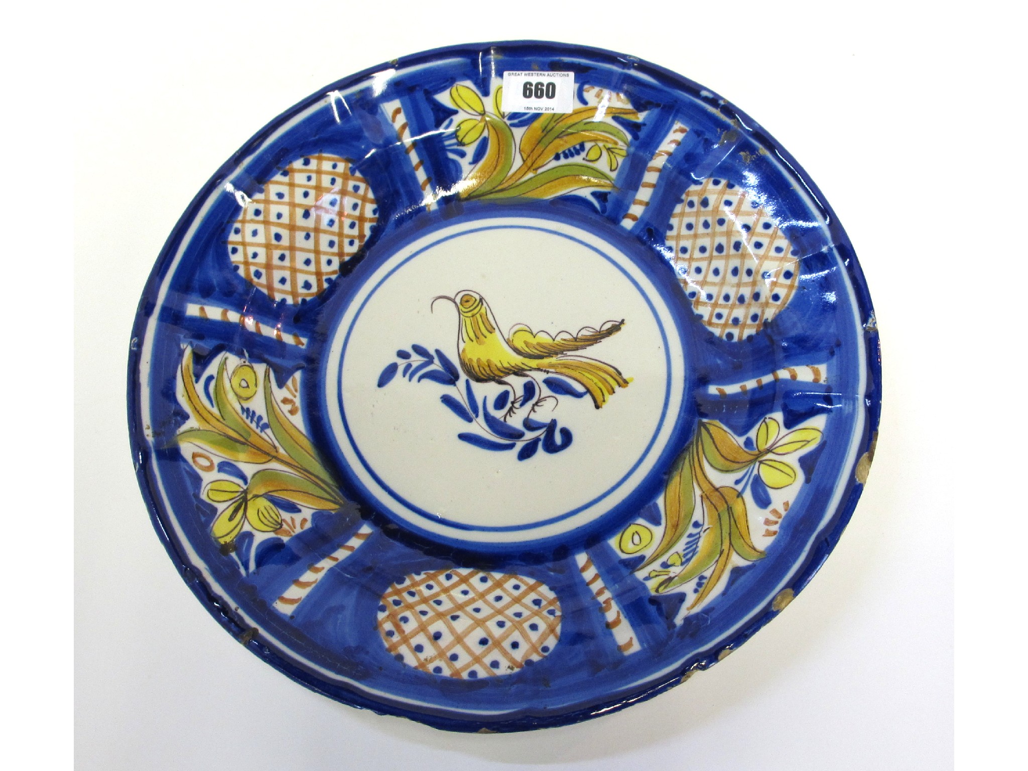 Appraisal: Tin glazed circular dish with bird and foliate decoration initialled