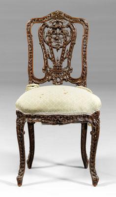 Appraisal: Rococo style carved side chair elaborately carved with floral and