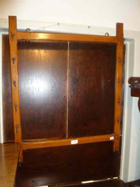 Appraisal: A VICTORIAN LIGHT OAK WHIP RACK with canted borders