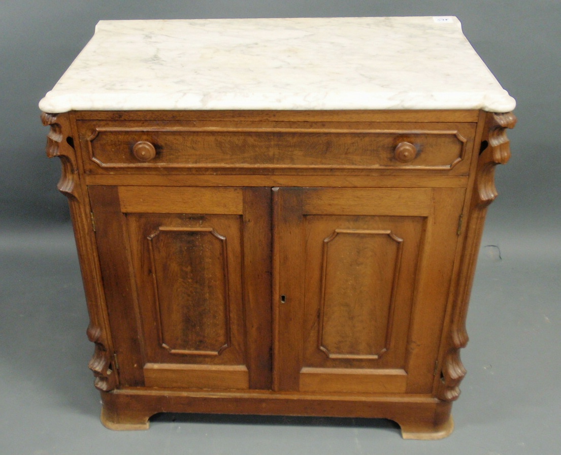 Appraisal: Victorian walnut washstand with marble top h x w x