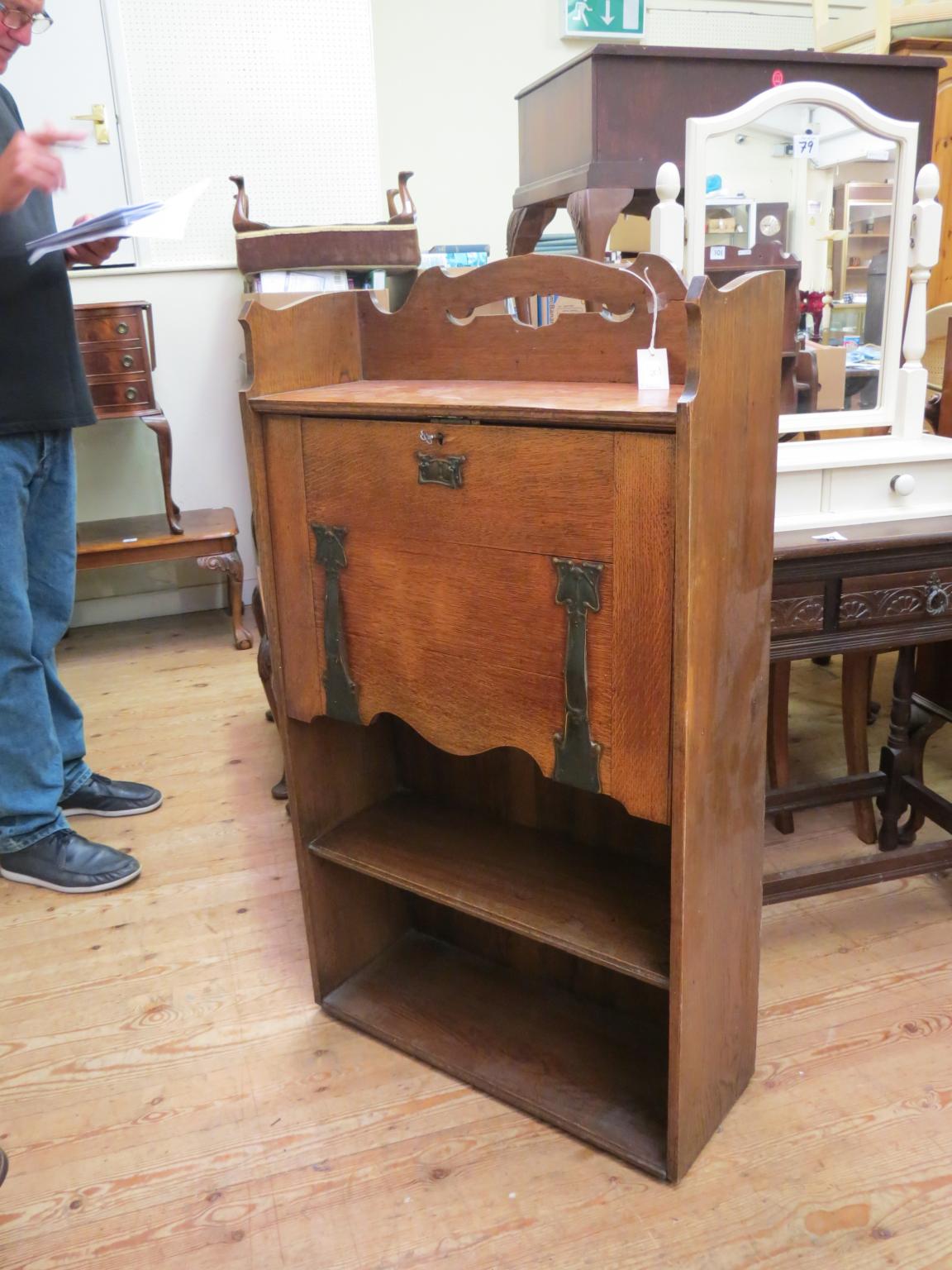 Appraisal: An early th century solid oak student's bureau with Art