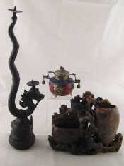 Appraisal: An Oriental double candlestick and bell formed as a dragon