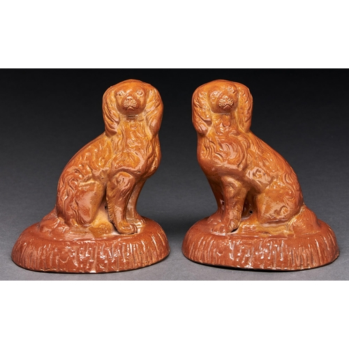 Appraisal: A pair of Derbyshire saltglazed brown stoneware models of spaniels