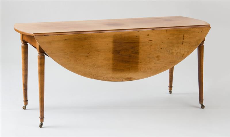 Appraisal: DIRECTOIRE WALNUT DROP LEAF OVAL DINING TABLE Fitted with a