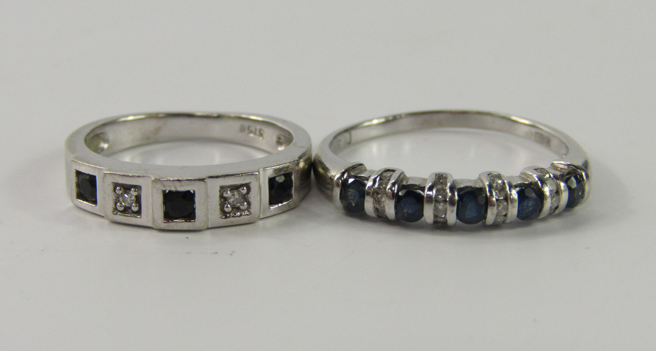 Appraisal: A white metal sapphire and diamond five stone band stamped