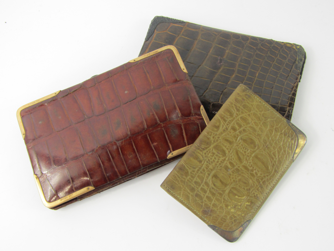 Appraisal: A ct gold mounted vintage crocodile skin pocket cigar case