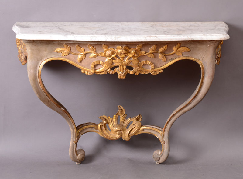 Appraisal: ITALIAN ROCOCO PAINTED AND PARCEL-GILT CONSOLE With a serpentine-fronted white