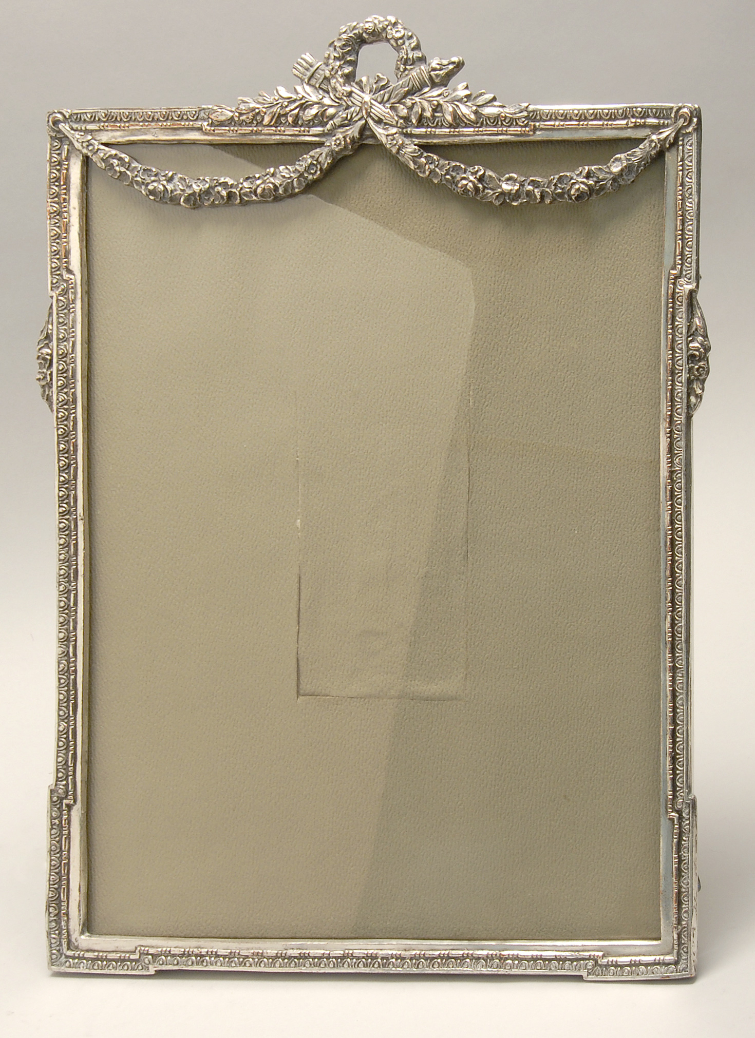 Appraisal: ENGLISH SILVER PLATED PICTURE FRAME Early th CenturyWith floral wreath