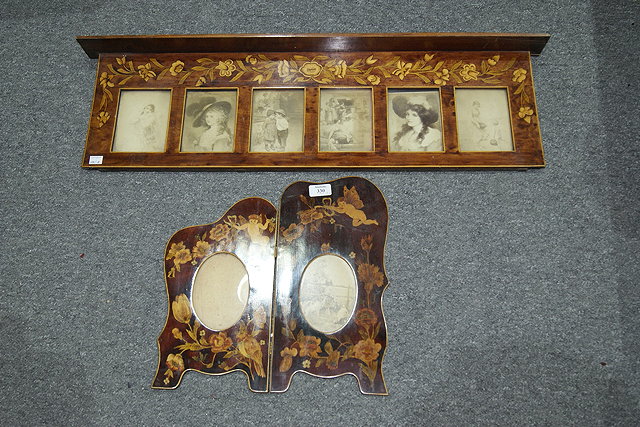 Appraisal: AN EDWARDIAN BI-FOLD FRAME with cupid and ribbon tie decoration