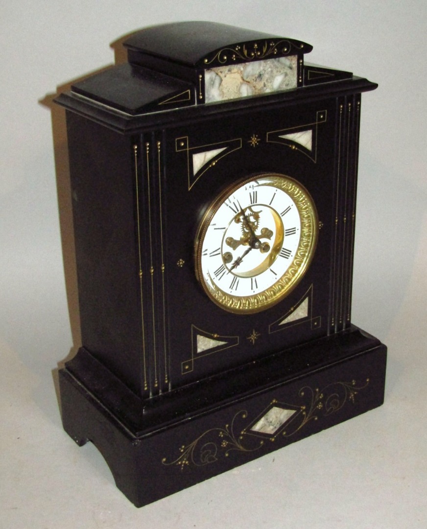 Appraisal: A late Victorian slate and marble mantel clock the classical