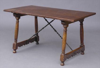 Appraisal: ITALIAN TH C -STYLE WALNUT TRESTLE TABLE The rectangular top