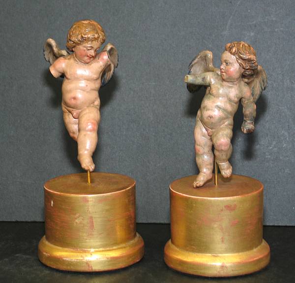 Appraisal: A pair of Italian polychrome wood miniature figures of putti