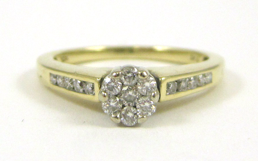 Appraisal: DIAMOND AND TEN KARAT GOLD RING set with round-cut diamonds