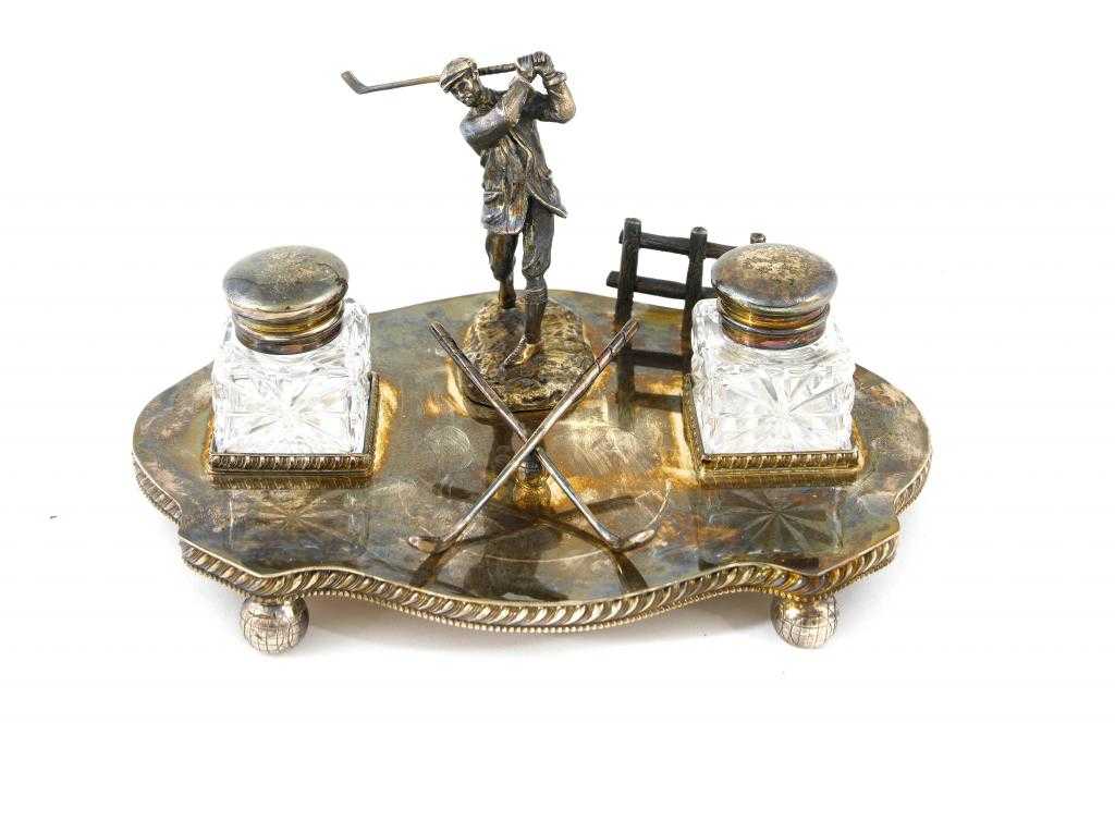 Appraisal: AN INKSTAND the gadrooned serpentine base set with the figure