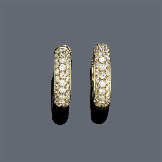 Appraisal: DIAMOND CREOLES Yellow gold Casual-elegant creole ear stud the top