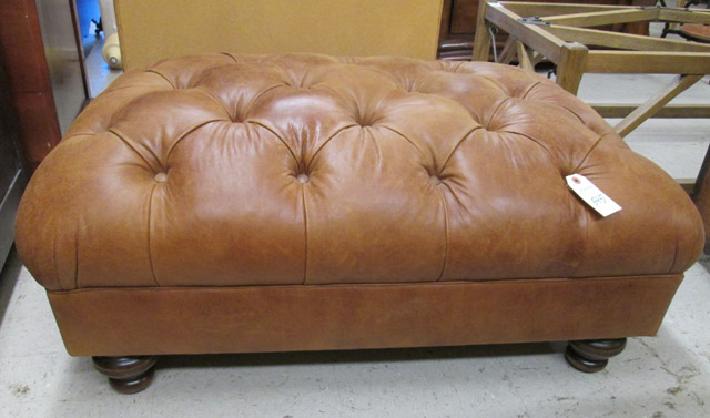 Appraisal: RECTANGULAR BROWN LEATHER OTTOMAN unknown maker dated having a button