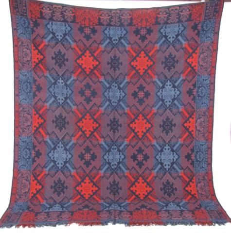 Appraisal: Red and blue woven jacquard coverlet full size four corner