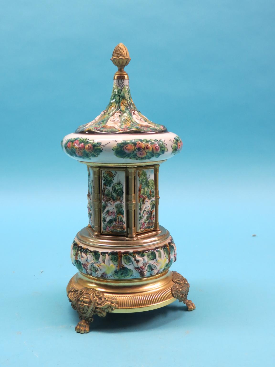 Appraisal: A Capodimonte-style musical carousel on ormolu plinth with claw feet