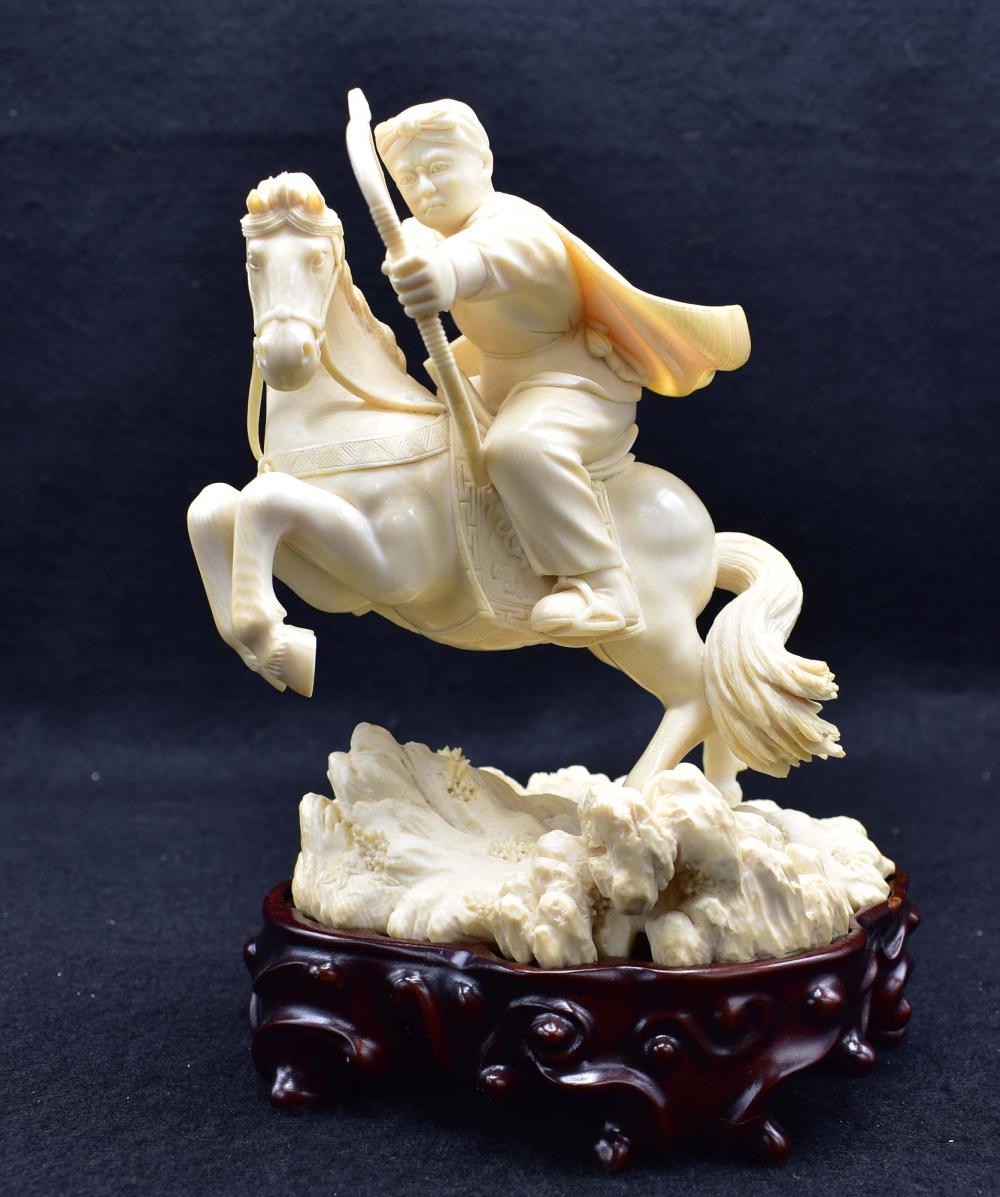 Appraisal: FINE CHINESE CARVING OF AN ARCHER ON HORSEBACK IN MOTIONEarly