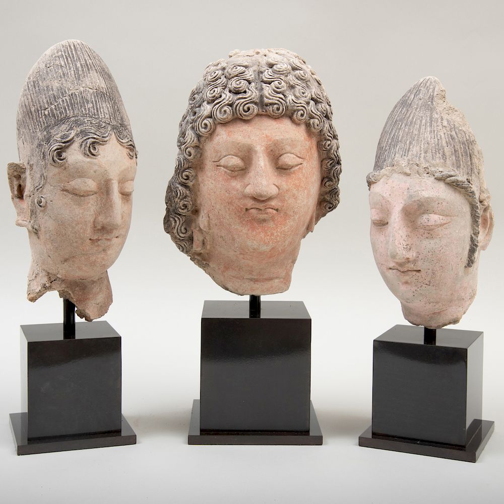 Appraisal: Group of Three Gandharan Clay Busts of Noblemen Group of