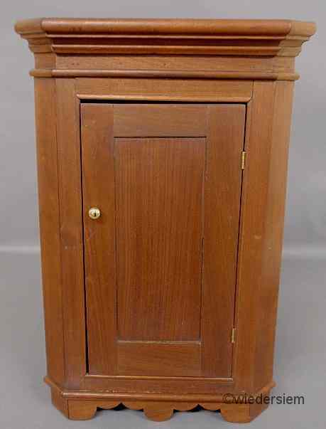 Appraisal: Walnut blind door hanging corner cupboard ''h x ''w