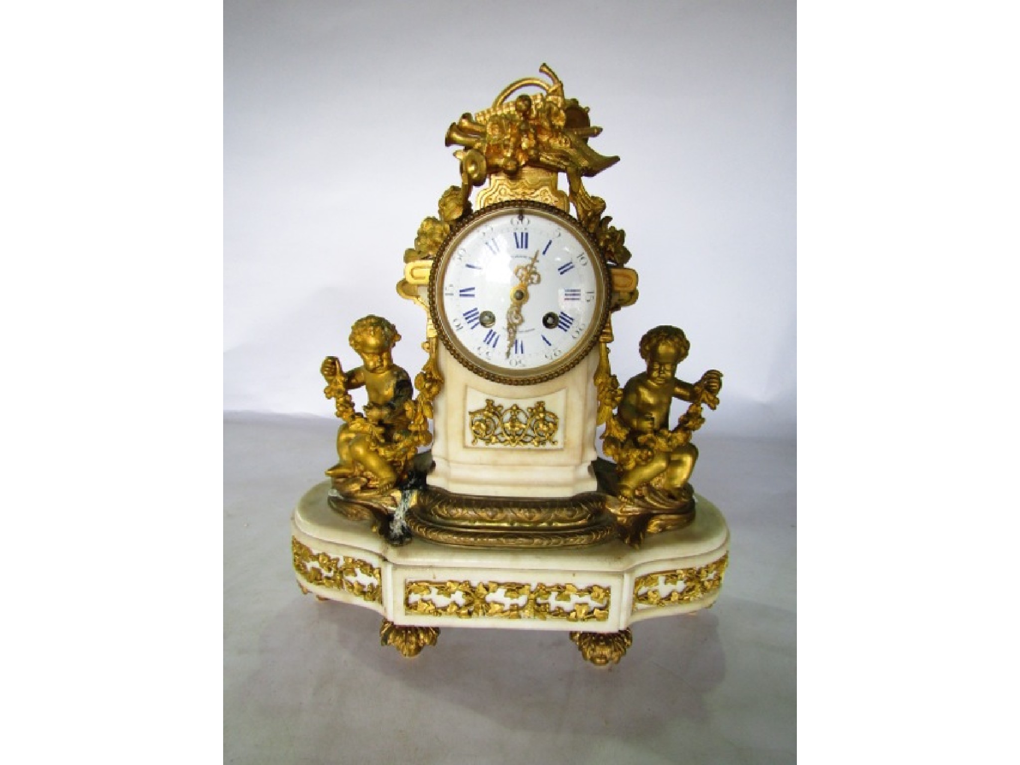 Appraisal: A Victorian alabaster and gilt brass mantle clock the convex