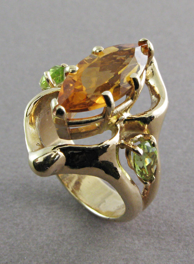 Appraisal: CITRINE PERIDOT AND YELLOW GOLD RING The k yellow gold