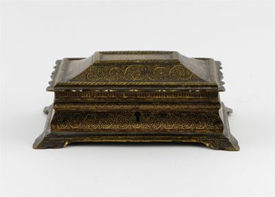 Appraisal: A Middle Eastern gilt-decorated iron casket with a hinged lid